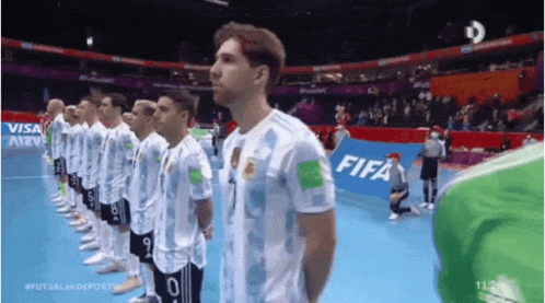 Soccer Players in a Line With FIFA Banner