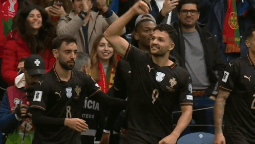 Soccer Players in Black Jerseys Number 8