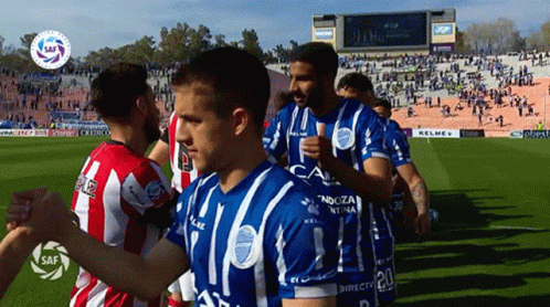 Soccer Players In Blue And White Jerseys Number 20 GIF