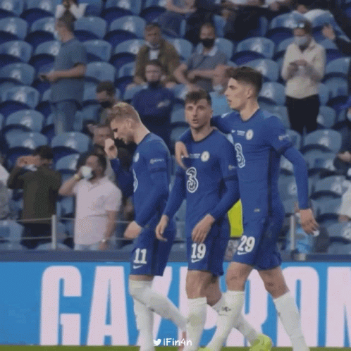Soccer Players in Blue Jerseys 11 and 29