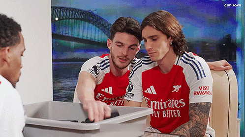 Soccer Players In Emirates Jerseys Looking At Trash GIF