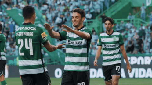 Soccer Players in Green and White Striped Betano Jerseys