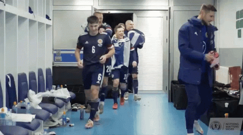 Soccer Players in Locker Room