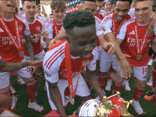 Soccer Players in Red and White with Emirates Fly