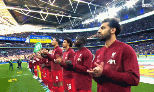 Soccer Players In Red Jerseys With Aya GIF