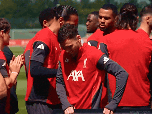 Soccer Players in Red Shirts with AXA