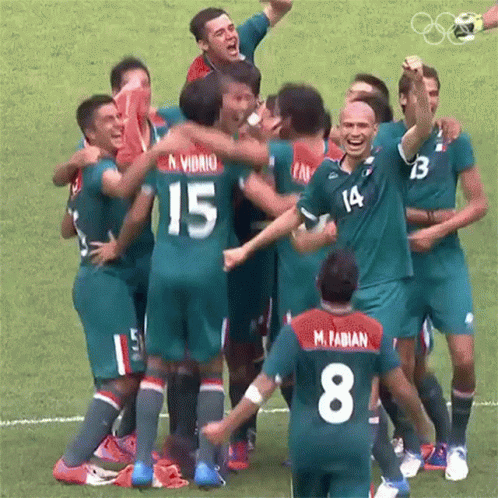 Soccer Players Number 15 and M. Fabian Celebrate