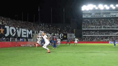 Soccer Players On A Field With A Banner That Says Jovem On It GIF
