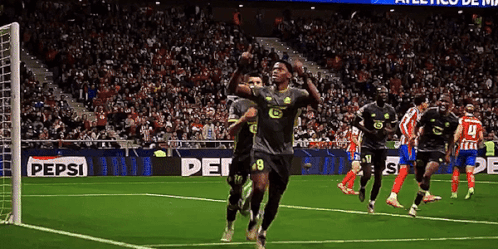 Soccer Players On A Field With A Pepsi Ad GIF