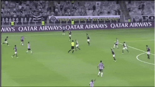 Soccer Players On A Field With A Qatar Airways Banner In The Background GIF