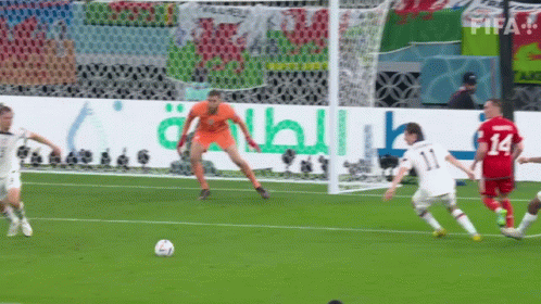 Soccer Players On A Field With A Qatar Energy Banner In The Background GIF