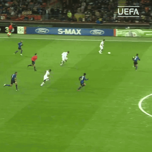 Soccer Players On A Field With A Sign That Says Enjoy Responsibly On It GIF