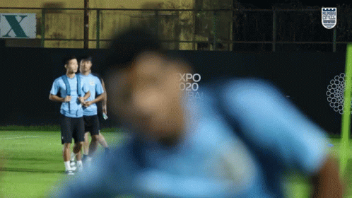 Soccer Players On A Field With A Sign That Says Expo 2020 On It GIF