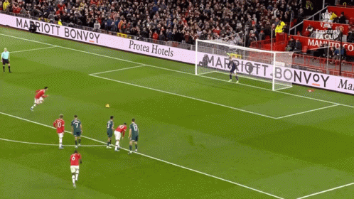 Soccer Players On A Field With Advertisements For Marriott Bonvoy GIF