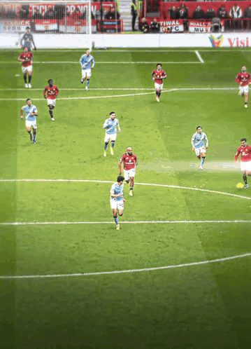 Soccer Players on Field One Pointing at Camera