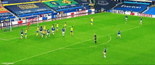 Soccer Players on Field With Beretta Ad