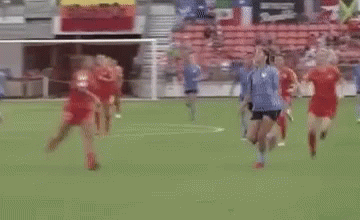 Soccer Players on Field With #dashtpo Sign