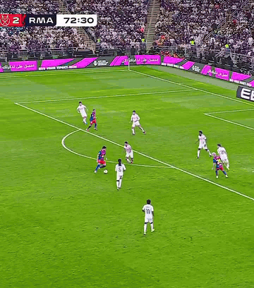 Soccer Players on Field with Ebro Sign