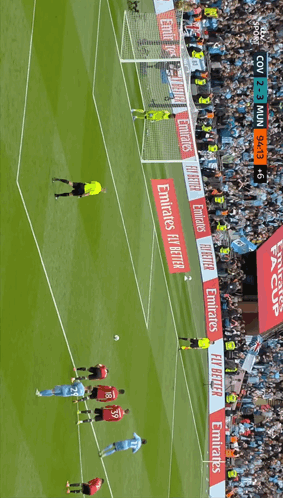 Soccer Players On Field With Emirates Banners GIF