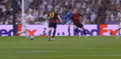 Soccer Players on Field With FedEx Ad