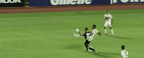 Soccer Players on Field With Gillette Sign