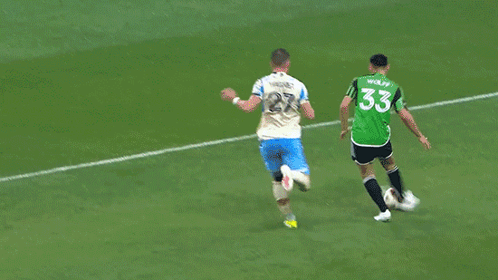 Soccer Players On Field With Goalie In Green Jersey 23 GIF