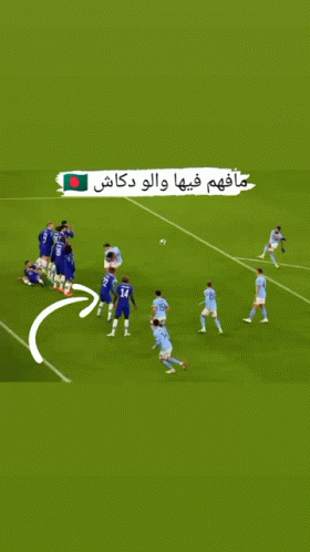 Soccer Players on Field With Green Flag