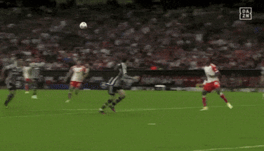 Soccer Players on Field with Heineken Ad
