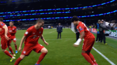 Soccer Players on Field With Heineken Shirt