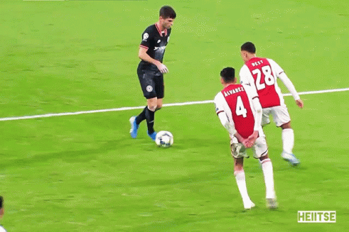 Soccer Players on Field With Lays Ad