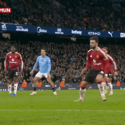 Soccer Players on Field with Midea Betway Ads