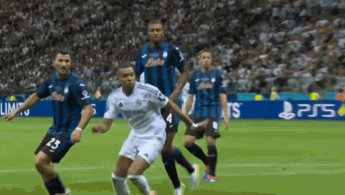 Soccer Players on Field with PS5 Ad