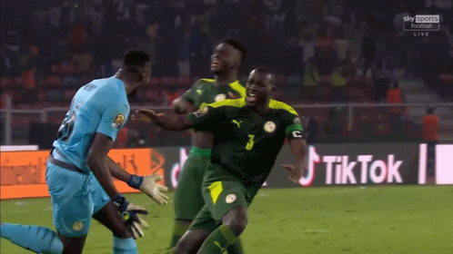 Soccer Players on Field With TikTok Sign