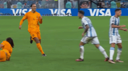 Soccer Players on Field With Visa Sign