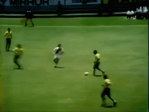 Soccer Players On Field With Yellow PS Sign GIF