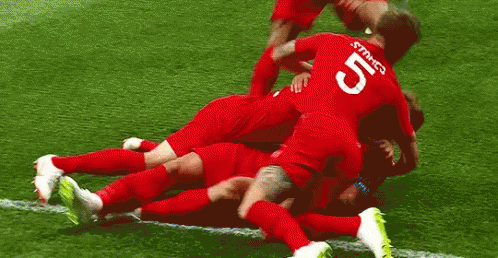 Soccer Players Pile