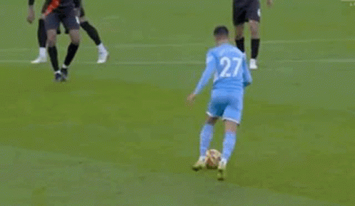 Soccer Players Playing Game on Field