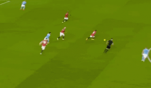 Soccer Players Playing on Field