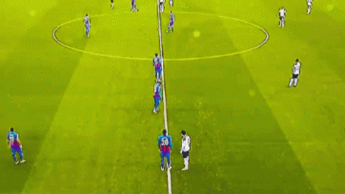 Soccer Players Playing on Field