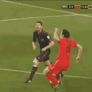 Soccer Players Playing on Field