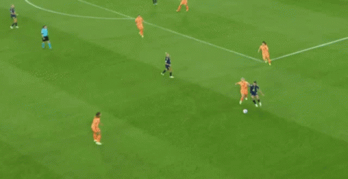 Soccer Players Playing on Field