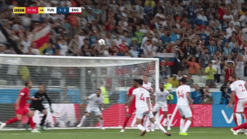 Soccer Players Playing On Field With Crowd Watching GIF