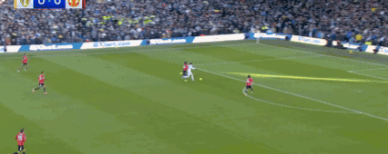 Soccer Players Playing on Field With Crowd