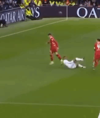 Soccer Players Playing on Field With Qatar Airlines Banner