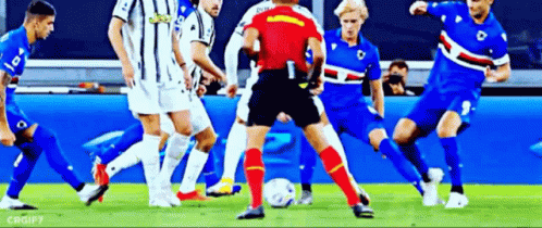 Soccer Players Playing Soccer on Field