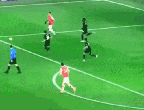 Soccer Players Playing with Er More Sign on Field