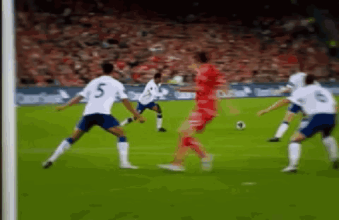 Soccer Players Playing with Number 5