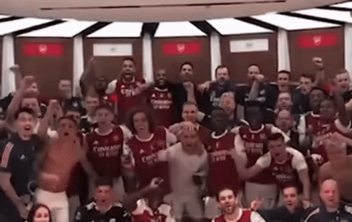 Soccer Players Posing in Dressing Room