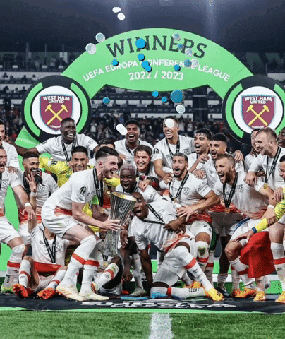 Soccer Players Posing In Front Of Winners Banner GIF