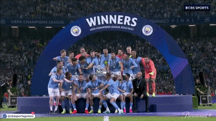 Soccer Players Posing Under Winners Arch